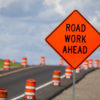 Waterline Construction on East Pine and on Central Road construction zone with orange warning sign.